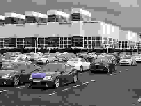 a fleet of cars parked in a parking lot